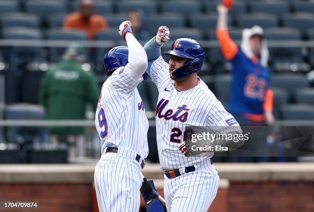 Pete Alonso of the New York Mets celebrates his two run home run with teammate Brandon Nimmo in the first inning against the Miami Marlins during...