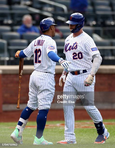 Pete Alonso of the New York Mets celebrates his two run home run with on deck teammate Francisco Lindor in the first inning against the Miami Marlins...