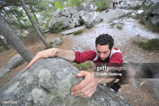 Rock climbing in Fontainebleau, France.