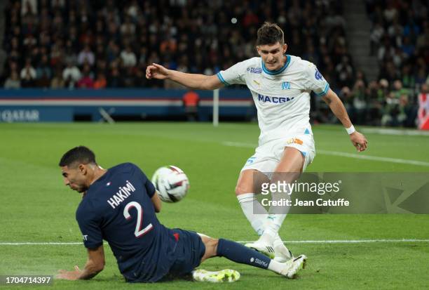 Leonardo Balerdi of Marseille, left Achraf Hakimi of PSG during the Ligue 1 Uber Eats match between Paris Saint-Germain and Olympique de Marseille at...