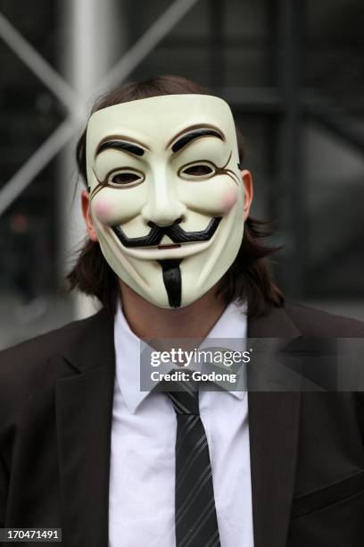 Protester wearing a Guy Fawkes mask, trademark of the Anonymous movement and based on a character in the film V for Vendetta, France.