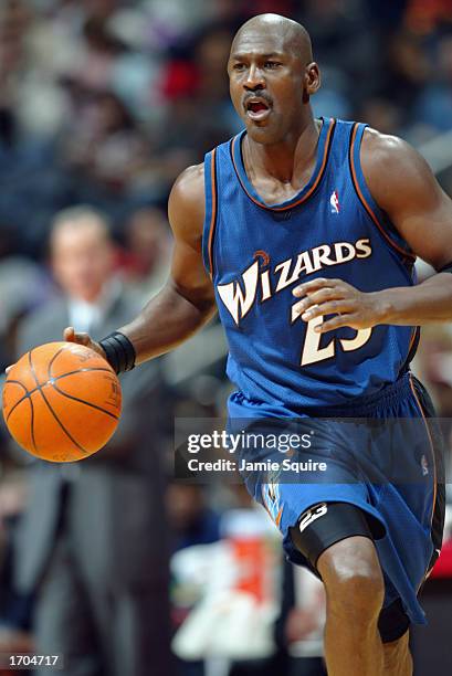 Guard Michael Jordan of the Washington Wizards dribbles the ball up the court against the Atlanta Hawks during the second half of the game on...