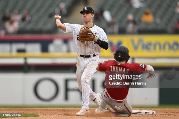Zach Remillard of the Chicago White Sox turns a double play in the seventh inning against Alek Thomas of the Arizona Diamondbacks at Guaranteed Rate...