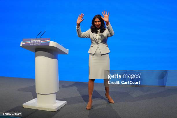 Britain's Home Secretary, Suella Braverman, waves after delivering her speech on the third day of the Conservative Party Conference on October 03,...