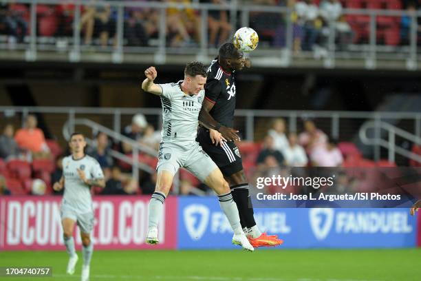 Christian Benteke of D.C. United heads the ball against Tanner Beason of the San Jose Earthquakes during a game between San Jose Earthquakes and D.C....