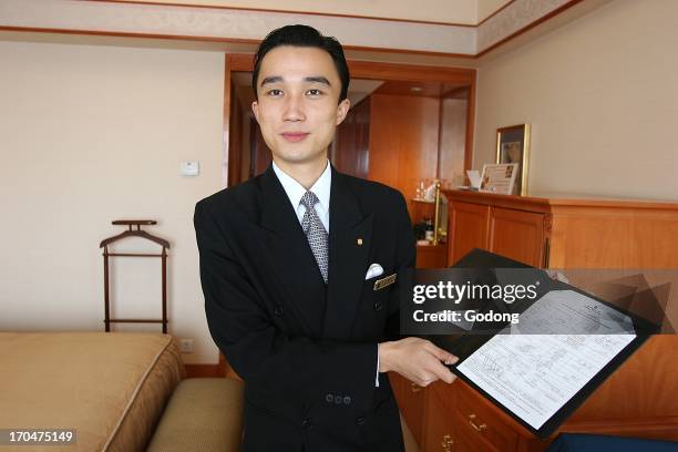 Hotel employee, Shanghai, Shanghai, China.