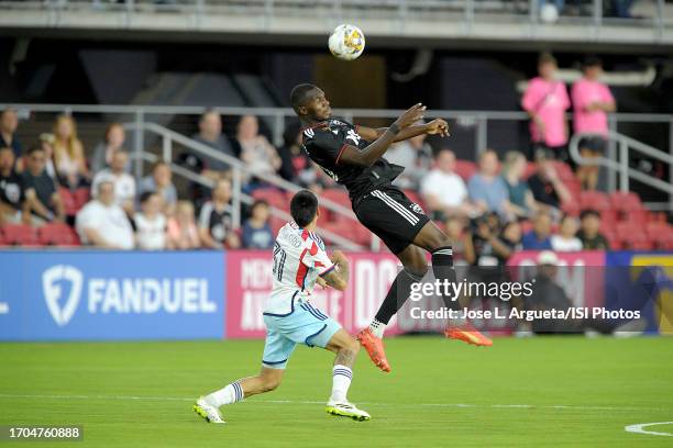 Christian Benteke of D.C. United heads the ball against Alvaro Barreal of FC Cincinnati during a game between Chicago Fire FC and D.C. United at Audi...