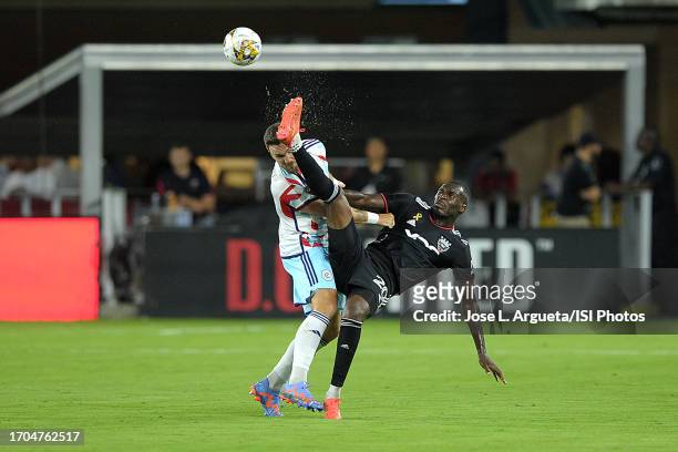 Christian Benteke of D.C. United battles for the ball with Rafael Czichos of Chicago Fire FC during a game between Chicago Fire FC and D.C. United at...