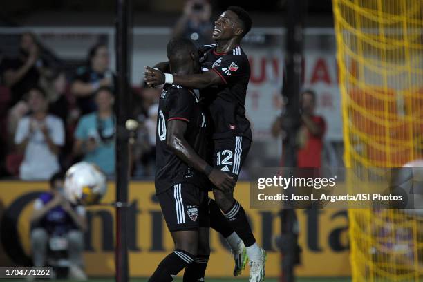 Christian Benteke of D.C. United celebrates his score with teammate Christian Dajome of D.C. United during a game between Chicago Fire FC and D.C....