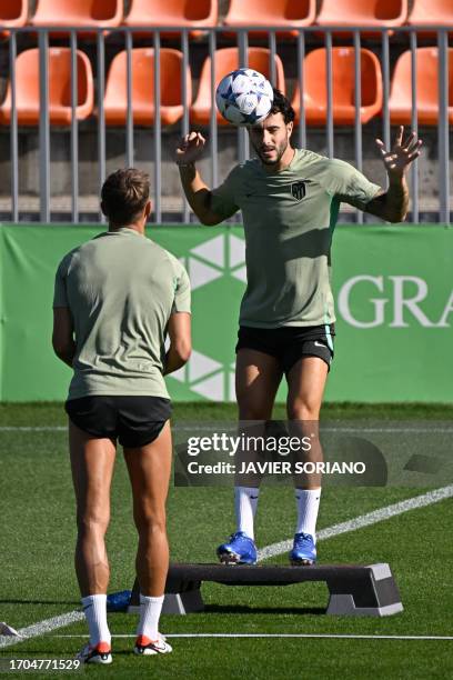 Atletico Madrid's Spanish defender Mario Hermoso attends a training session on the eve of their UEFA Champions League football match against...