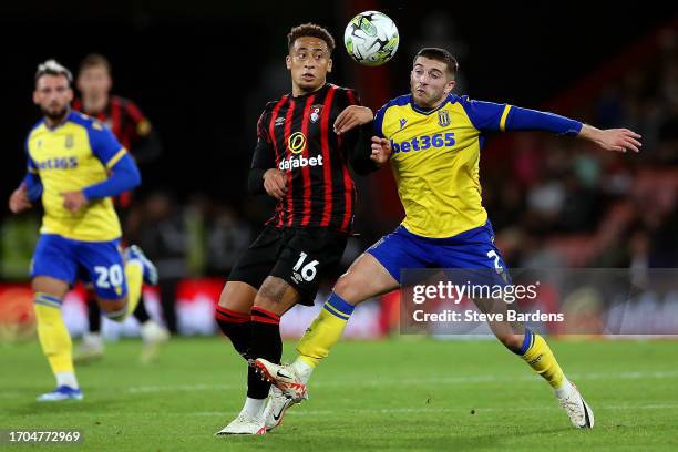 Marcus Tavernier of AFC Bournemouth battles for possession with Lynden Gooch of Stoke City during the Carabao Cup Third Round match between AFC...