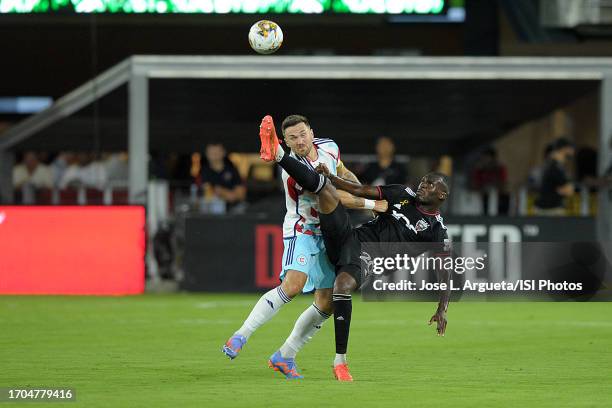 Christian Benteke of D.C. United battles for the ball with Rafael Czichos of Chicago Fire FC during a game between Chicago Fire FC and D.C. United at...