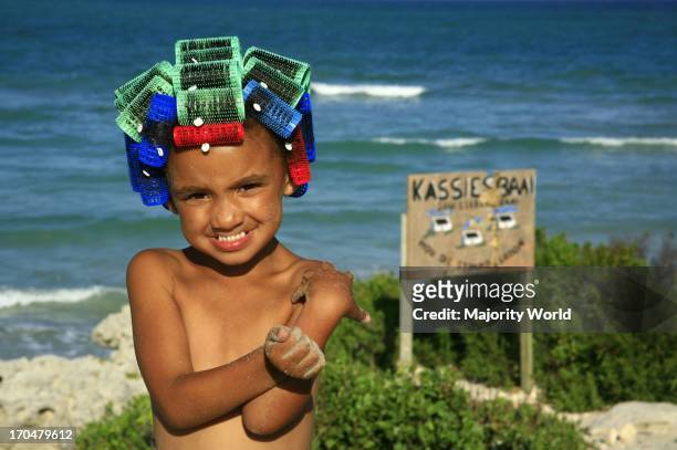 Little girl in Arniston, a small fishing village near the southern most tip of Africa, Cape Agulhas, where Indian and Atlantic oceans meet. It was...