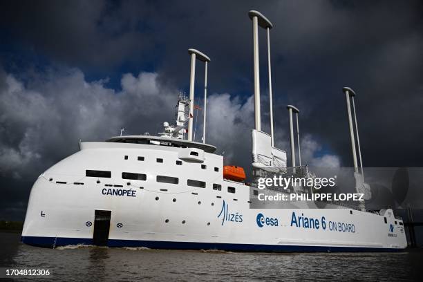 This photograph taken on October 3 on the Garonne river in Bordeaux shows the "Canopee" cargo ship, built to transport elements for the Ariane 6...