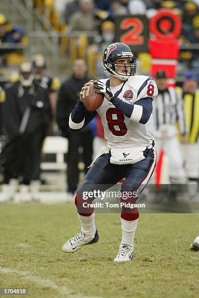 David Carr of the Houston Texans sets up to pass during a game against the Pittsburgh Steelers on December 8, 2002 at Heinz Field in Pittsburgh,...