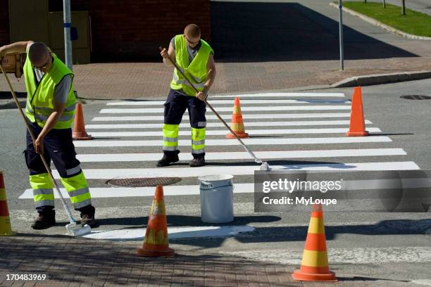 Men Painting Crosswalk Stripes.