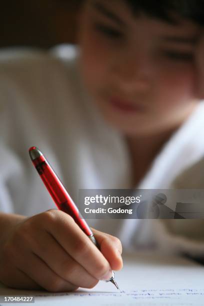 Boy writing a letter