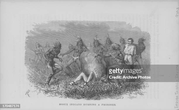 Engraving depicting Native American Indians of the Sioux Tribe, burning a prisoner and torturing another in an act of brutality against the US...