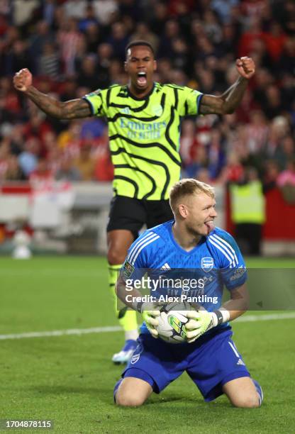 Aaron Ramsdale and Gabriel of Arsenal celebrate at full-time during the Carabao Cup Third Round match between Brentford and Arsenal at Gtech...
