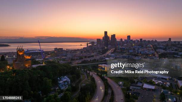 aerial sunset freeway into seattle - seattle ferry stock pictures, royalty-free photos & images