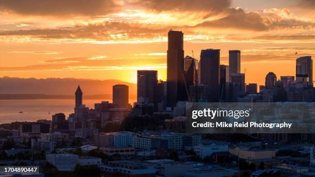 backlit seattle sunset skyline looking west - seattle ferry stock pictures, royalty-free photos & images