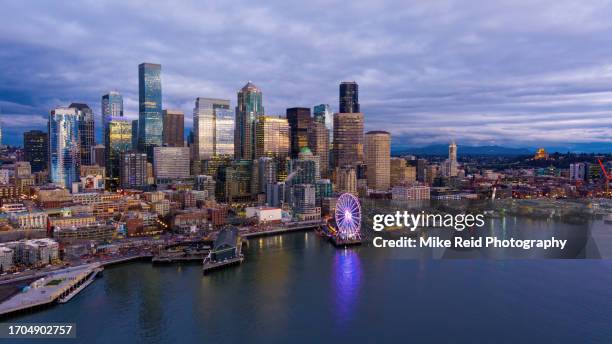 aerial seattle waterfront and wheel at dusk - seattle ferry stock pictures, royalty-free photos & images