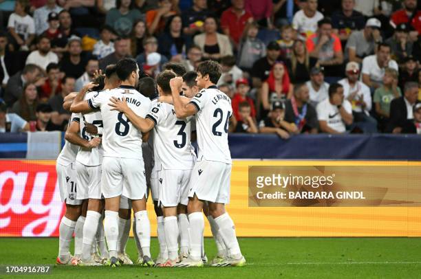 Real Sociedad's player celebrate after scoring their 0-1 goal during the UEFA Champions League Group D football match between Red Bull Salzburg and...