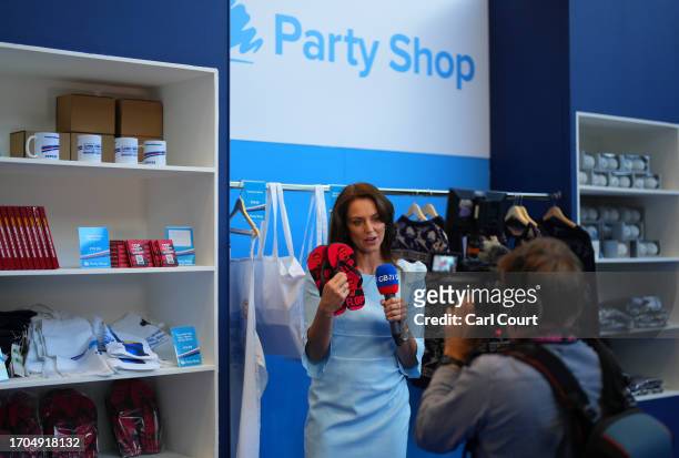 News presenter Beverley Turner holds up a pair of flip-flops featuring a picture of opposition Labour Party leader Keir Starmer on the third day of...