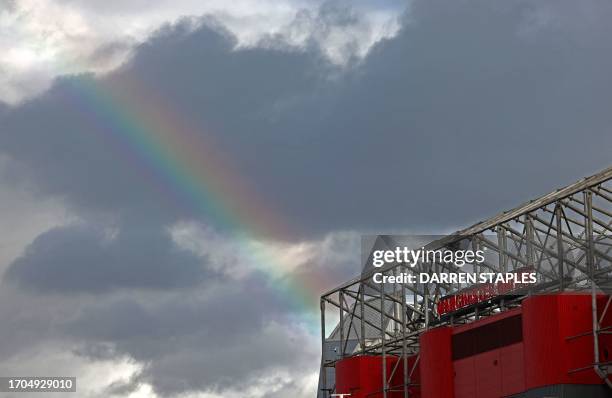 Rainbow is pictured in the sky near Old Trafford stadium in Manchester, north west England, on October 3 ahead of the UEFA Champions league group A...