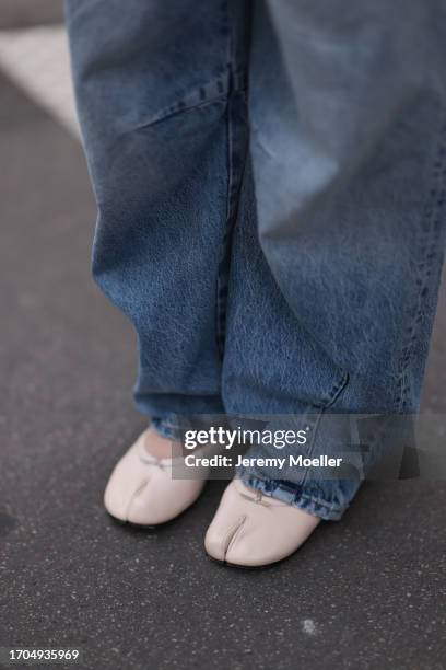 Sonia Lyson is seen wearing wide jeans from Zara and beige leather ballet flats from Ducie London on September 27, 2023 in Paris, France.