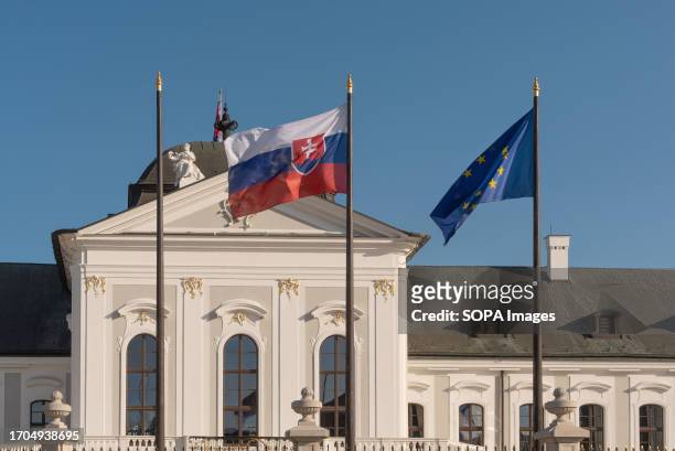 Slovak and EU flags fly outside the Grassalkovich Palace, an official residence of the President of the Republic of Slovakia.