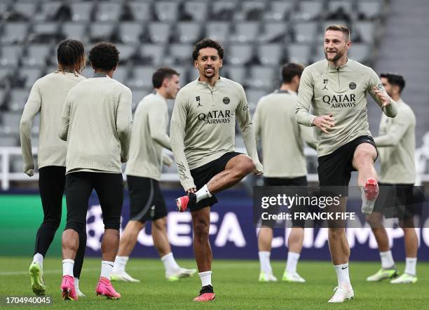 Paris Saint-Germain's Brazilian defender Marquinhos and Paris Saint-Germain's Slovak defender Milan Skriniar attends a team training session at St...