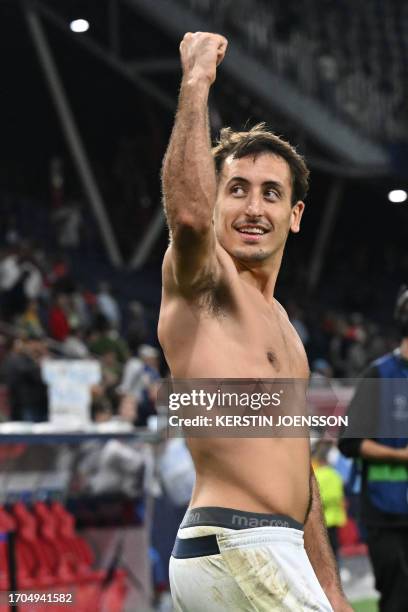 Real Sociedad's Spanish midfielder Mikel Oiarzabal celebrates after winning the UEFA Champions League Group D football match between Red Bull...