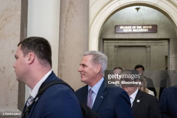 House Speaker Kevin McCarthy, a Republican from California, center, walks to the House chamber in Washington, DC, US, on Tuesday, Oct. 3, 2023....