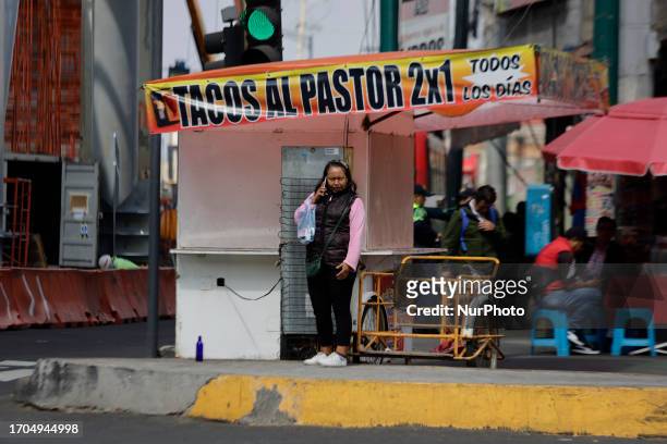 Woman crosses Av. Tlahuac and Periferico in Mexico City. In recent weeks, various groups of transport workers in Mexico City and the Metropolitan...