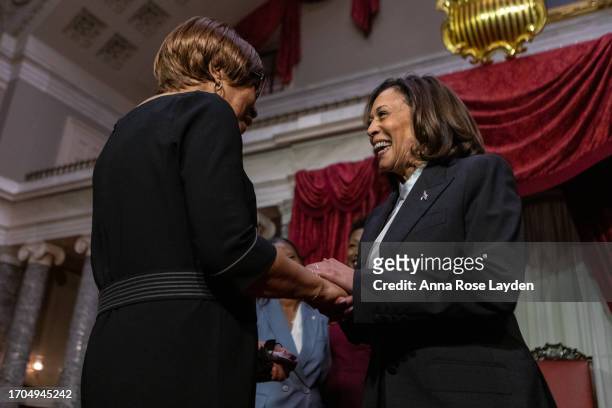 Vice President Kamala Harris greets Laphonza Butler's mother in the Old Senate Chamber at the U.S. Capitol on October 3, 2023 in Washington DC....
