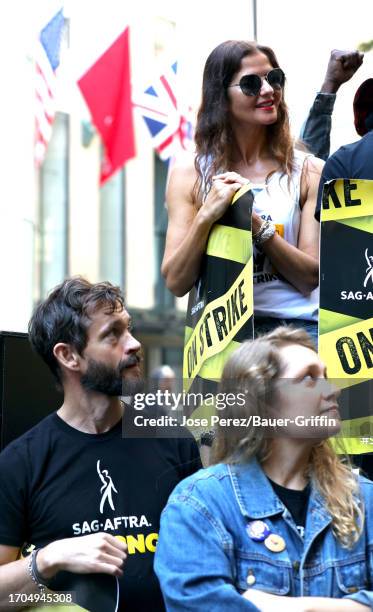 Hugh Dancy and Jill Hennessy are seen on the SAG-AFTRA picket line on October 03, 2023 in New York City.