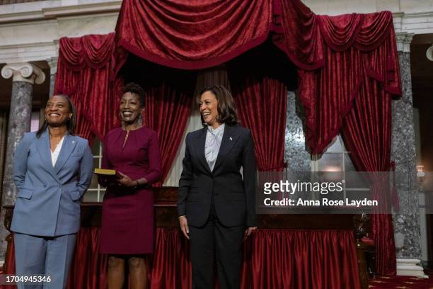 Sen. Laphonza Butler smiles with her wife, Neneki Lee after she is sworn in by Vice President Kamala Harris in the Old Senate Chamber at the U.S....