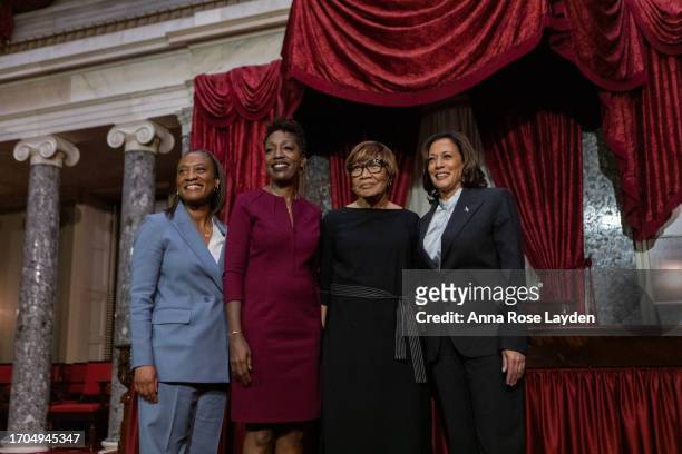 Sen. Laphonza Butler with her wife, Neneki Lee, her mother, and Vice President Kamala Harris pose after a swearing-in ceremony in the Old Senate...