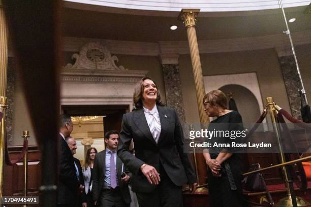 Vice President Kamala Harris smiles as she enters the Old Senate Chamber for the ceremonial swearing in of senator-delegate Laphonza Butler at the...