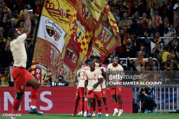 Lens' French forward Elye Wahi celebrates after scoring a goal his team's second goal during the UEFA Champions League Group B first leg football...