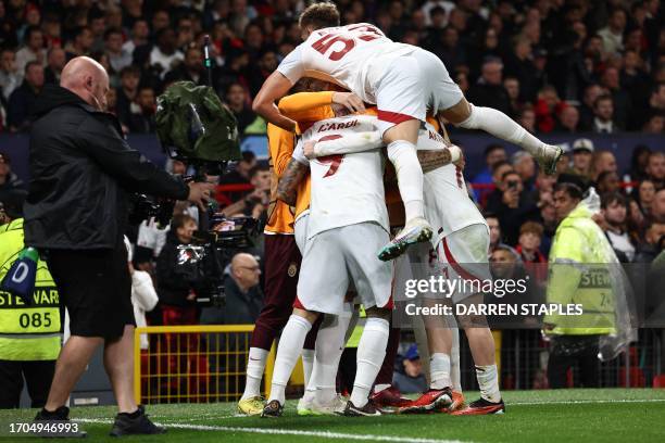 Is mobbed by teammates after scoring the team's third goalGalatasaray's Argentine forward Mauro Icardi during the UEFA Champions league group A...