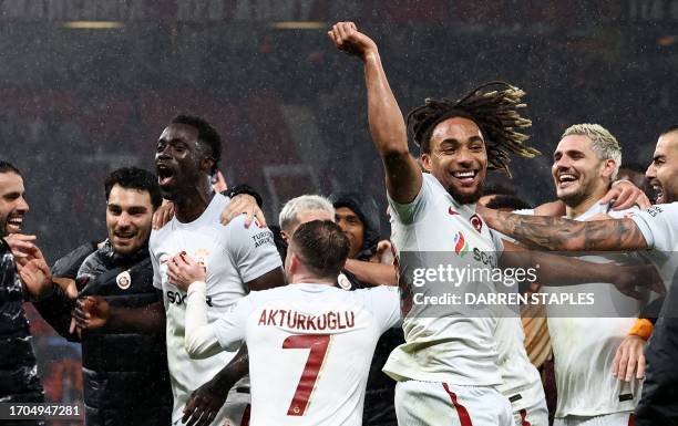 Galatasaray players celebrate after the UEFA Champions league group A football match between Manchester United and Galatasaray at Old Trafford...