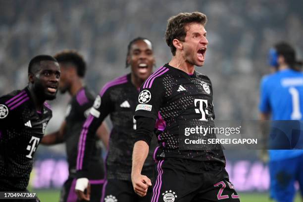 Bayern Munich's German forward Thomas Mueller celebrates after the 1-2 goal during the UEFA Champions League Group A football match between FC...