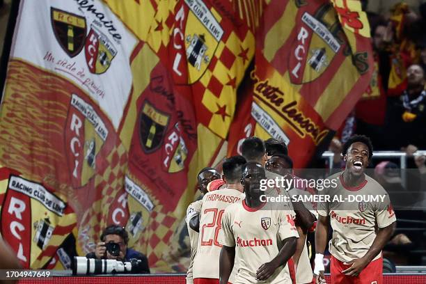 Lens' French forward Elye Wahi celebrates after scoring a goal his team's second goal during the UEFA Champions League Group B first leg football...