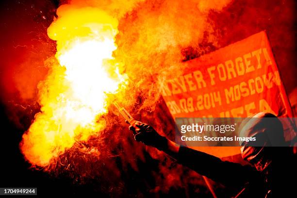 Supporters of FC Bayern Munchen with fireworks during the UEFA Champions League match between FC Copenhagen v Bayern Munchen at the Parken Stadium on...
