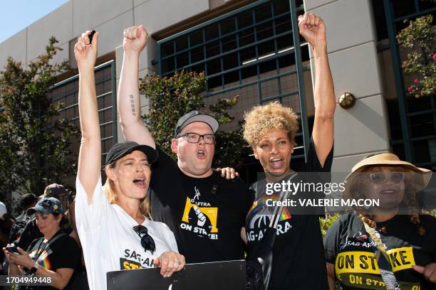 Actress Jeri Ryan, Duncan Crabtree-Ireland, executive director and chief negotiator for SAG AFTRA, and actress Michelle Hurd protest with the SAG...