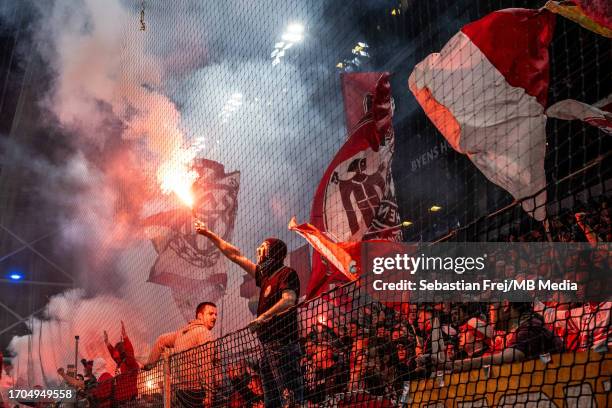 Ultras fans of Bayern Munich set up flares during the UEFA Champions League match between F.C. Copenhagen and FC Bayern Munchen at Parken Stadium on...