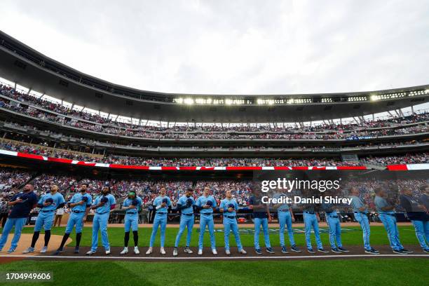 Players from the Toronto Blue Jays stand on the third base line during Game 1 of the Wild Card Series between the Toronto Blue Jays and the Minnesota...