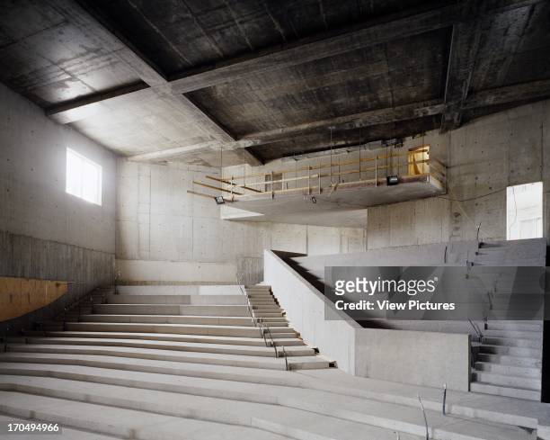 View of theatre space during construction showing sandblasted concrete prior to application of terrazzo cladding, exposed ceiling structure and...